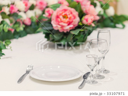 Served table for one person with a set of glasses Served table for one person with a set of glasses 33107971