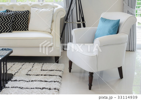 white and blue pillows on a white leather couch white and blue pillows on a white leather couch 33114939