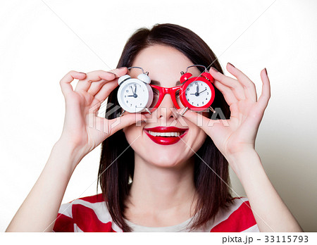 woman in glasses with retro alarm clock woman in glasses with retro alarm clock 33115793