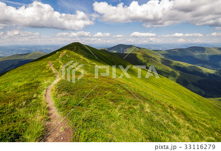 path through the grassy mountain ridge path through the grassy mountain ridge 33116279