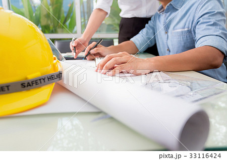 Hands of engineer working with the tool 33116424