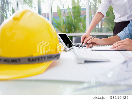 Hands of engineer working with the tool 33116425