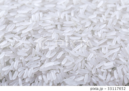 Dry uncooked rice background Dry uncooked rice background 33117652