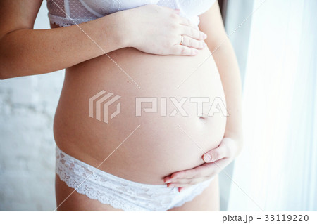 Close up of a cute pregnant belly 33119220