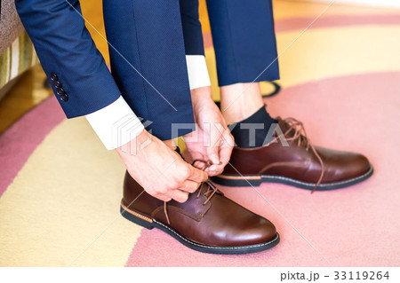 The man wears shoes 33119264