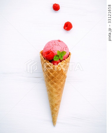 Raspberry ice cream in cone . Raspberry ice cream in cone . 33121658