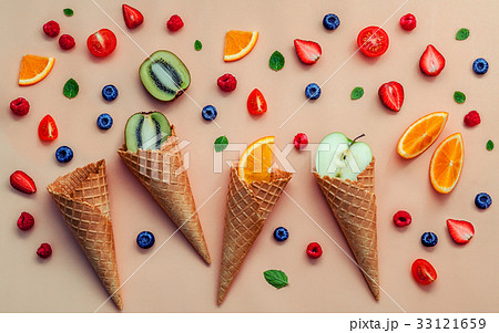 Cones and colorful various fruits raspberry. 33121659