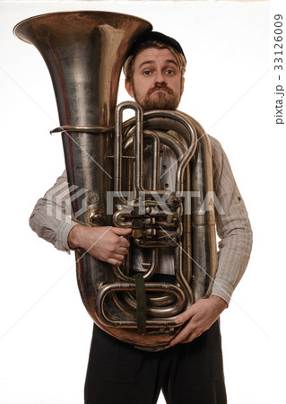 surprised man with cap holding the tube 33126009