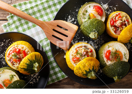 Yellow zucchini baked with bulgur and meat Yellow zucchini baked with bulgur and meat 33126059
