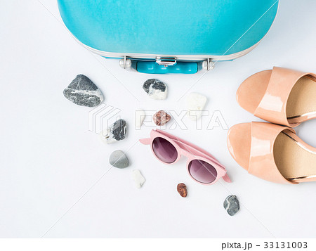 Blue suitcase, coconut, sandals, sun glasses Blue suitcase, coconut, sandals, sun glasses 33131003