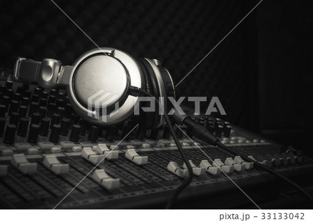 Headphones or Earphone on sound music mixer. Headphones or Earphone on sound music mixer. 33133042