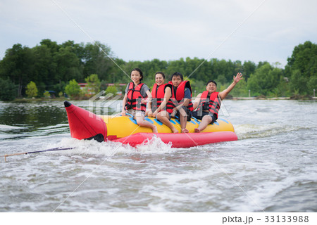 Asian family play banana boat 33133988
