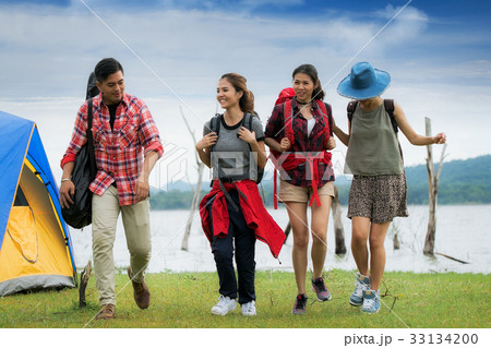 Asian friends walking in camping 33134200
