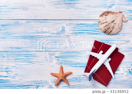 Travel objects on blue wooden background 33136952