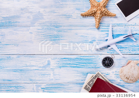 Travel objects on blue wooden background Travel objects on blue wooden background 33136954