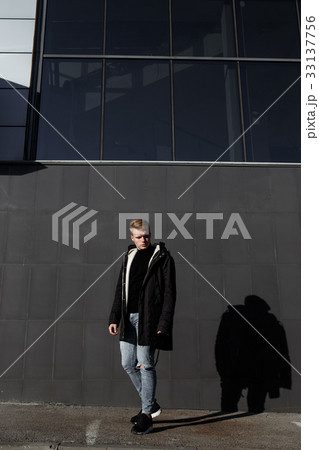 Young stylish redhead man in trendy outfit posing Young stylish redhead man in trendy outfit posing 33137756