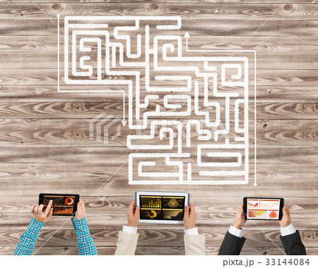 Top view of businesspeople sitting at table and using gadgets 33144084