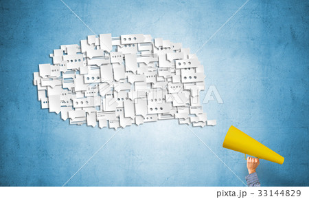 Hand of man holding red paper trumpet and speech cloud 33144829