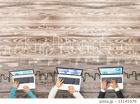 Top view of businesspeople sitting at table and using gadgets 33145076