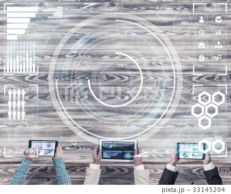 Top view of businesspeople sitting at table and using gadgets 33145204