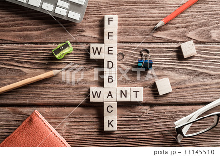 Conceptual media keywords on table with elements of game making crossword 33145510