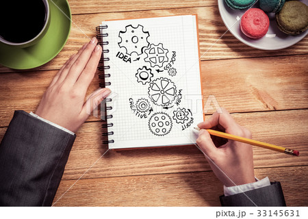 Businesswoman sketching in notepad Businesswoman sketching in notepad 33145631