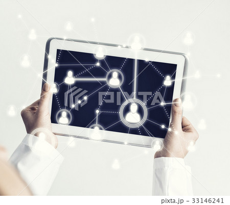 Close of female doctor hands working with tablet pc computer 33146241