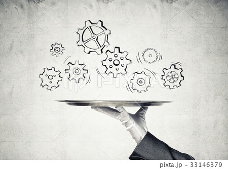 Waiter hand with empty silver tray and drawn gears concept 33146379