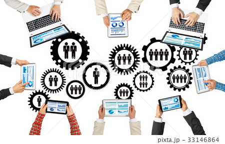 Top view of businesspeople sitting at table and using gadgets Top view of businesspeople sitting at table and using gadgets 33146864