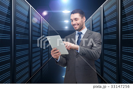 businessman with tablet pc over server room businessman with tablet pc over server room 33147256