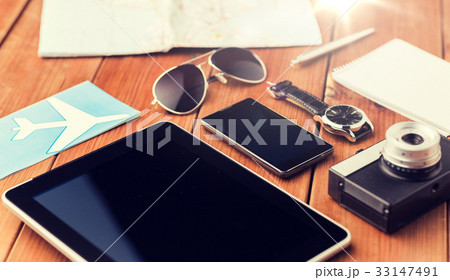 close up of smartphone and travel stuff 33147491