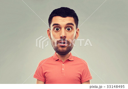 surprised man in polo t-shirt over gray background surprised man in polo t-shirt over gray background 33148495
