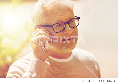 happy senior man calling on smartphone in city happy senior man calling on smartphone in city 33148823