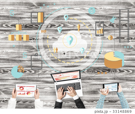 Top view of businesspeople sitting at table and using gadgets 33148869