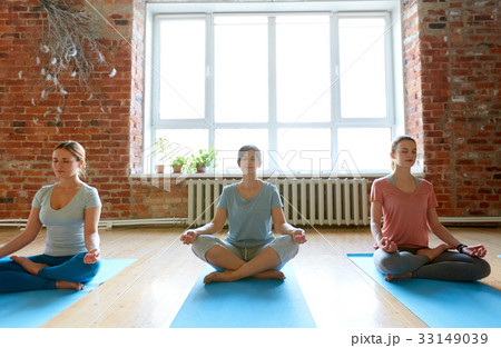 group of people meditating at yoga studio group of people meditating at yoga studio 33149039