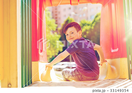 happy little boy on slide at children playground 33149354