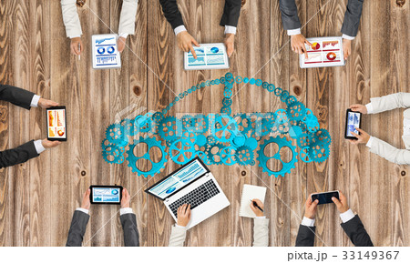 Top view of businesspeople sitting at table and using gadgets 33149367
