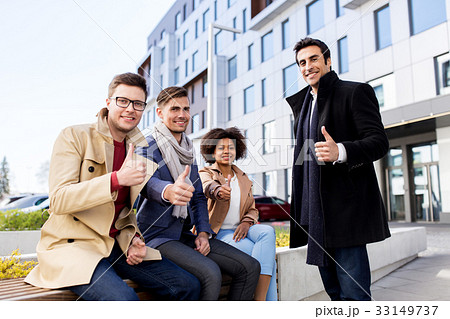 international business team showing thumbs up international business team showing thumbs up 33149737