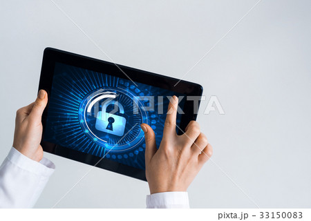 Close of female doctor hands working with tablet pc computer Close of female doctor hands working with tablet pc computer 33150083
