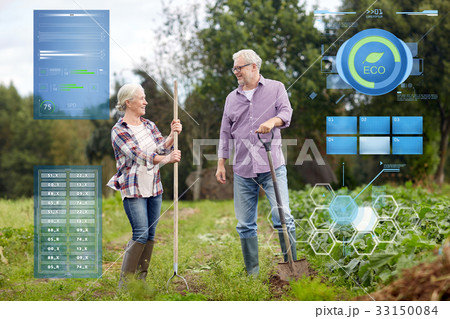 senior couple with shovels at garden or farm senior couple with shovels at garden or farm 33150084