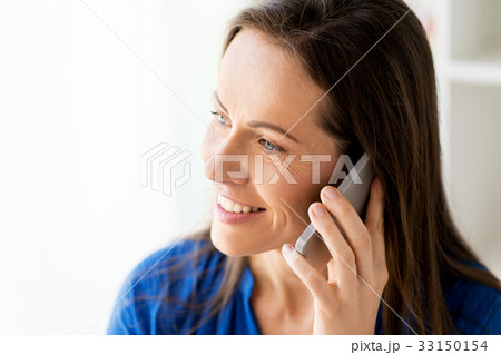 close up of happy woman calling on smartphone close up of happy woman calling on smartphone 33150154
