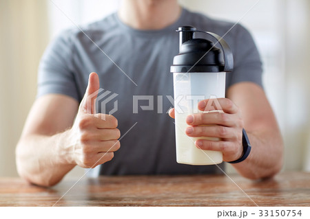 man with protein food showing thumbs up 33150754