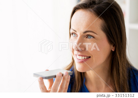 woman using voice recorder on smartphone 33151312