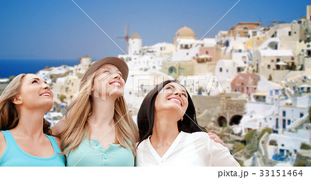 happy women over santorini island background 33151464