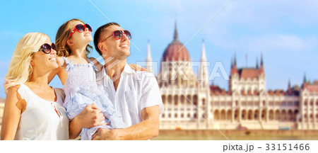 happy family over house of parliament in budapest 33151466