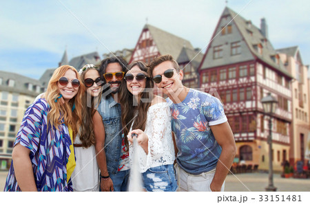 happy hippie friends taking selfie in frankfurt 33151481