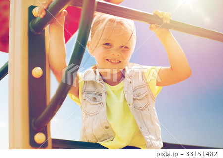 happy little girl climbing on children playground 33151482