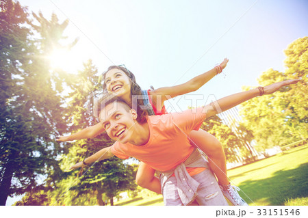 happy teenage couple having fun at summer park happy teenage couple having fun at summer park 33151546