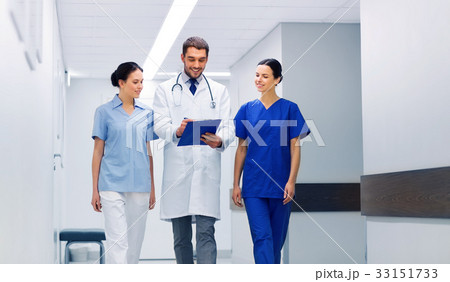 group of medics at hospital with clipboard 33151733