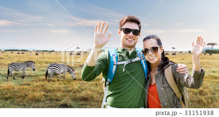 smiling couple with backpacks traveling in africa 33151938